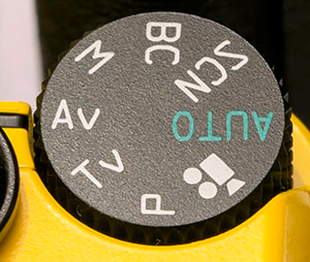 عکس 2. پیچ حالتهای دوربین پنتاکس Q7 از جمله حالت عکاسی خودکار